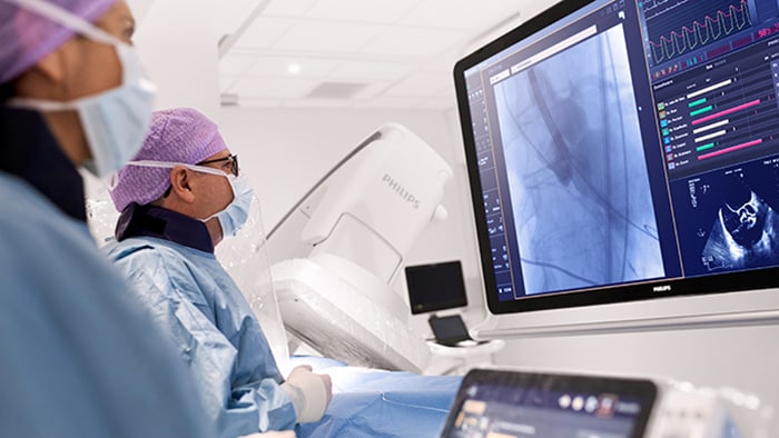 Interventional cardiologist treating patient in Azurion Suite mobile