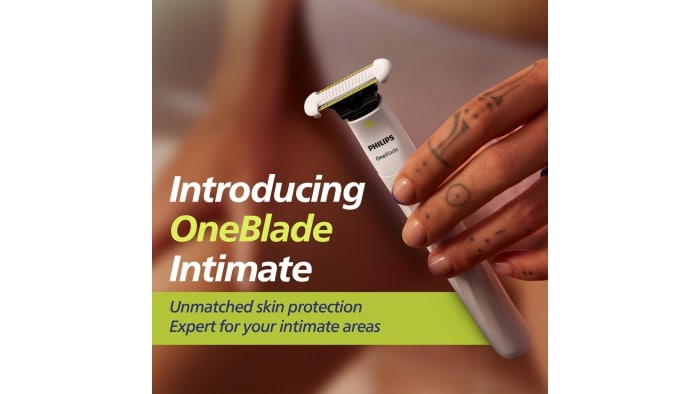 Close-up of a hand holding Philips OneBlade Intimate